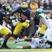 Michigan senior quarterback Denard Robinson jumps through a hole in coverage during the first quarter against Michigan State at Michigan Stadium on Saturday afternoon. Melanie Maxwell I AnnArbor.com
